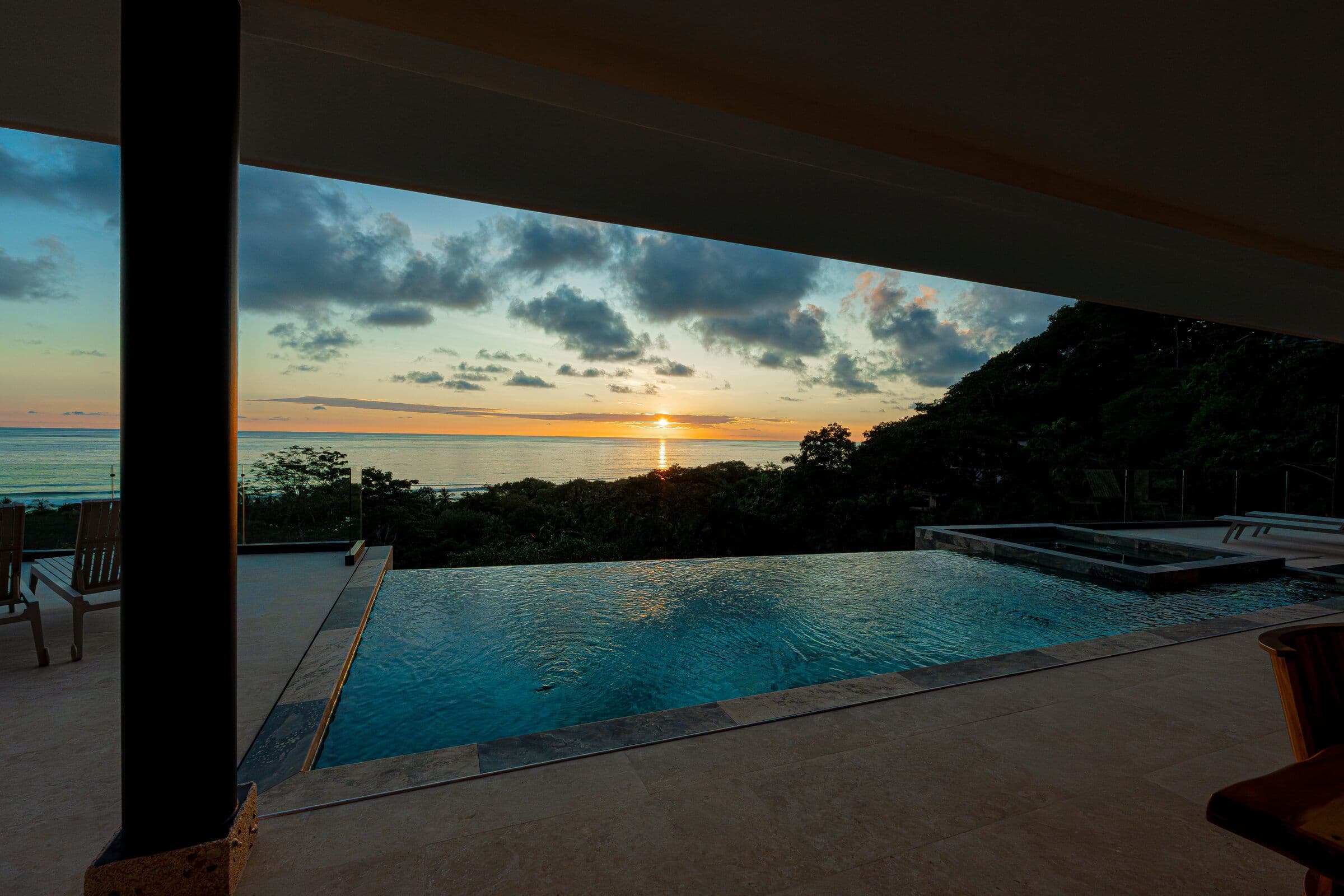 Infinity pool reflecting the sunset