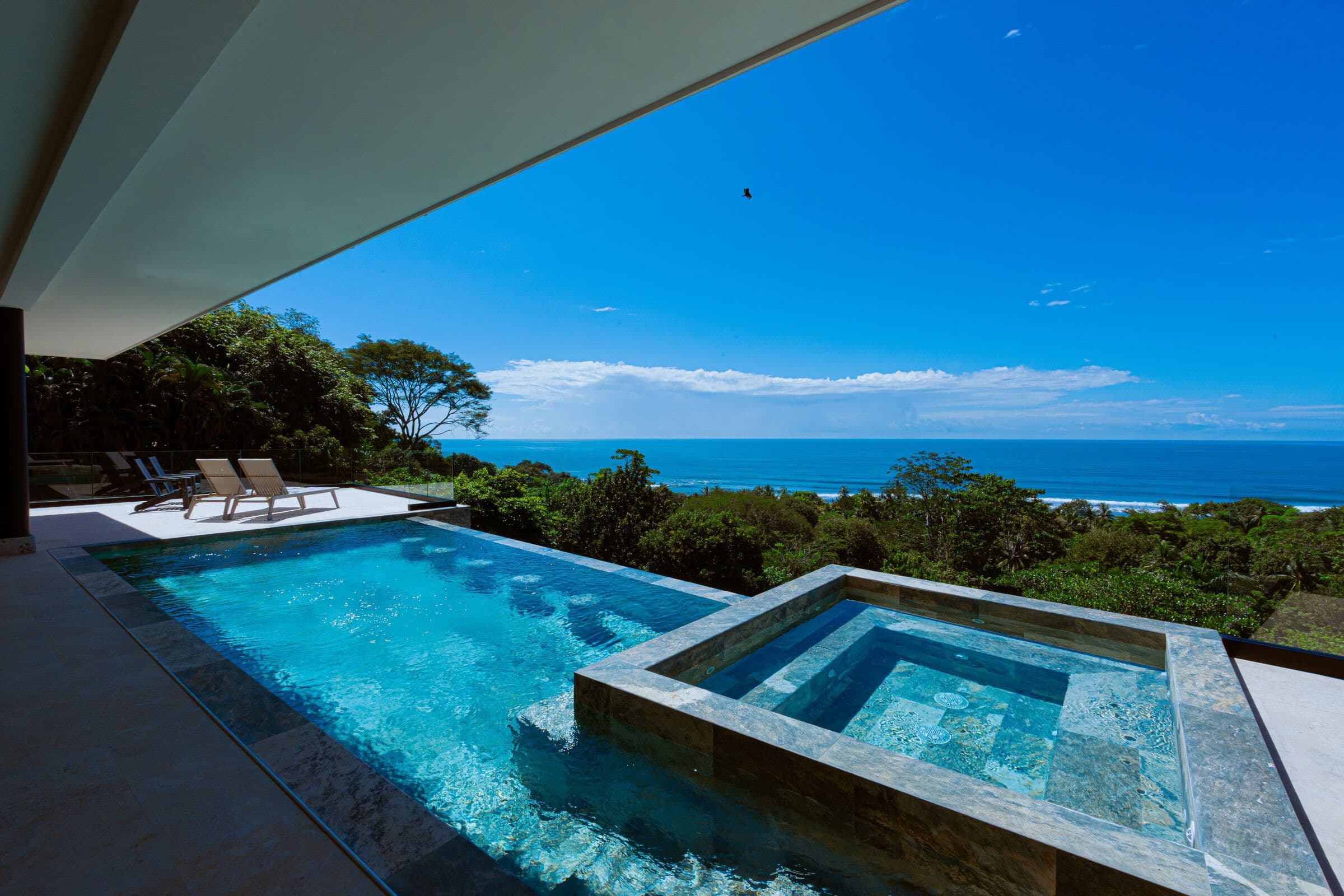 Jacuzzi with loungers and ocean view