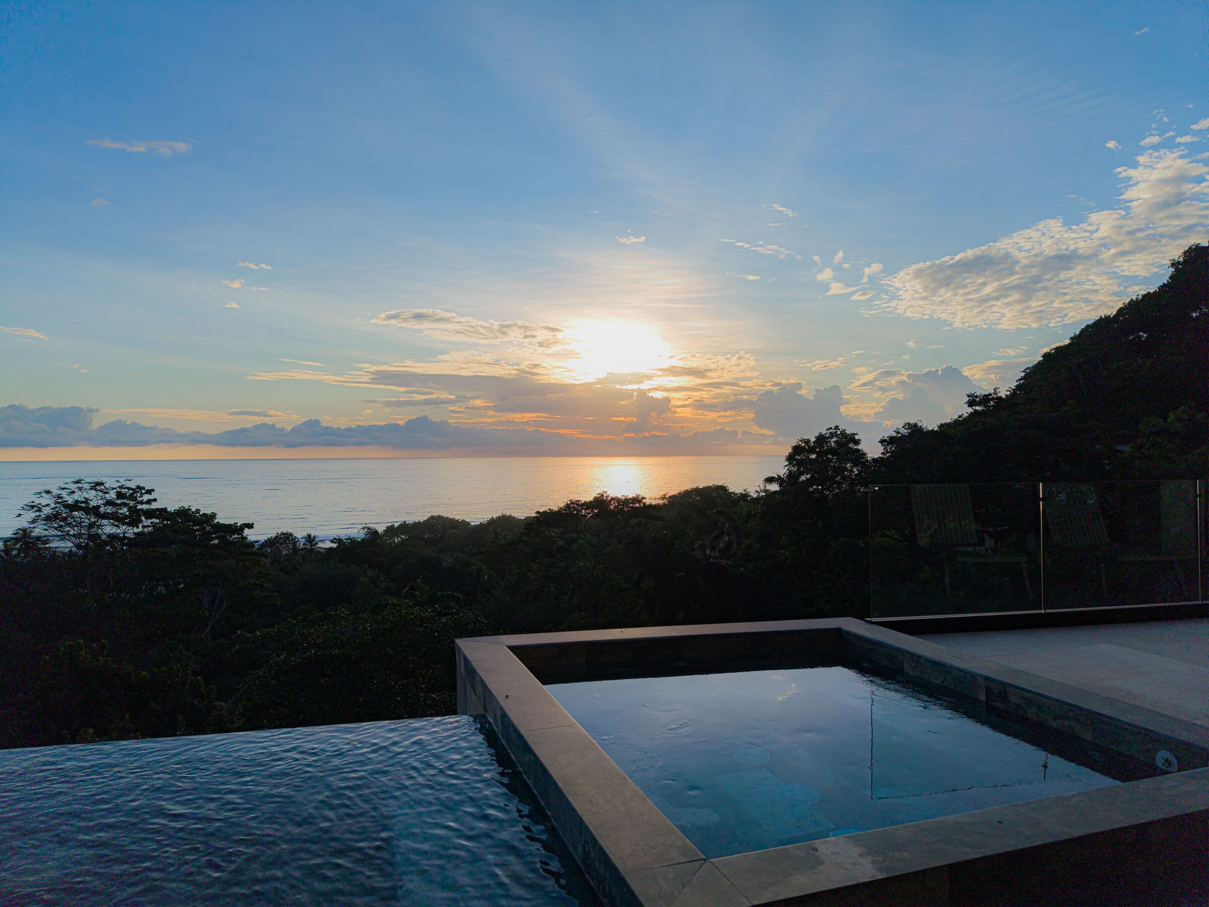 Aerial view of pool and jacuzzi at sunset