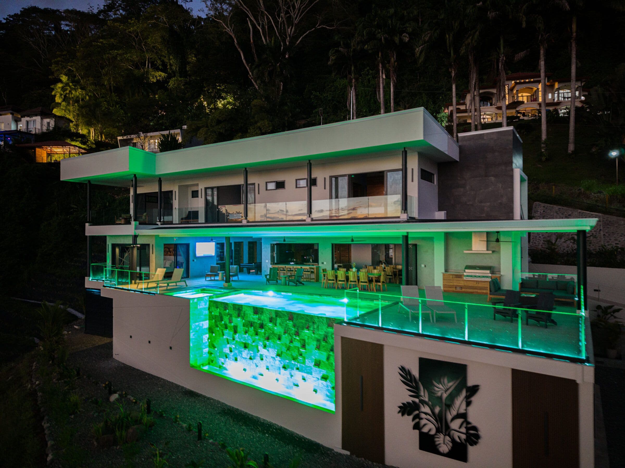 Full facade with green LED lighting at night