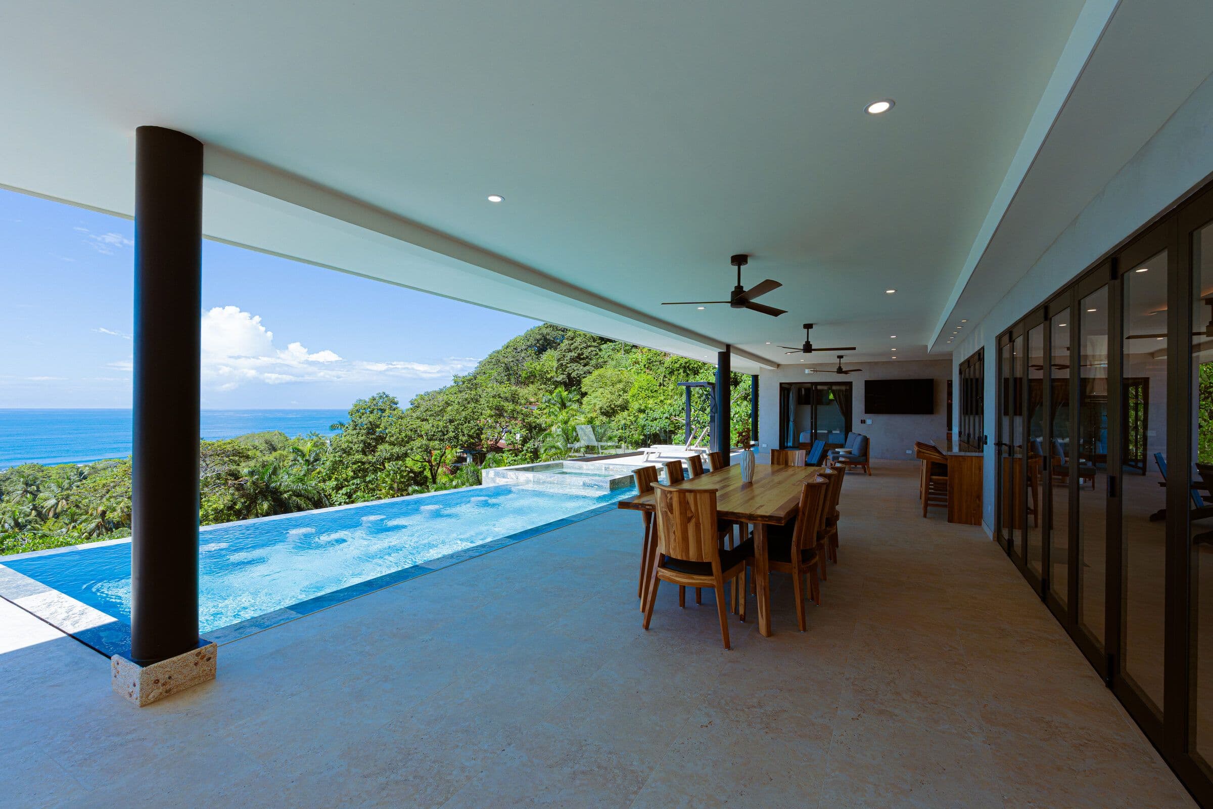Covered terrace with dining and pool