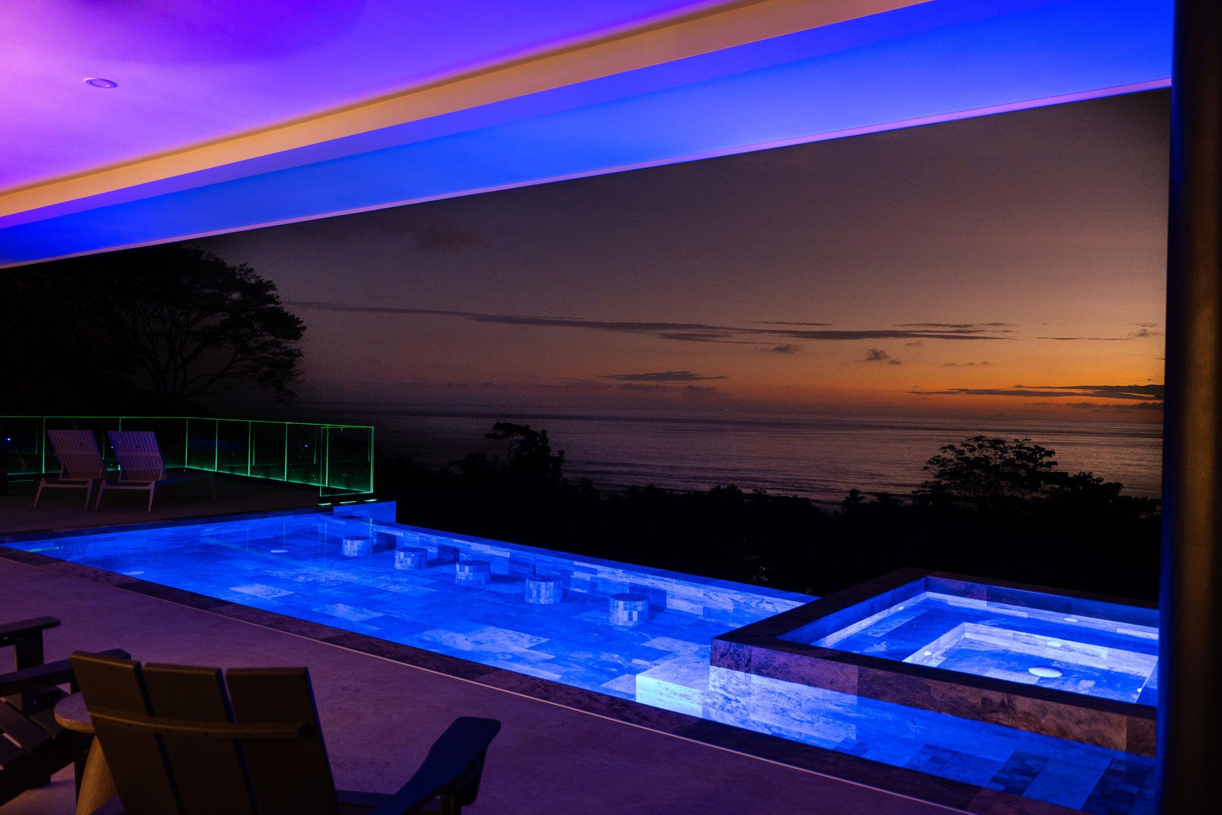 Blue and purple LED pool at dusk