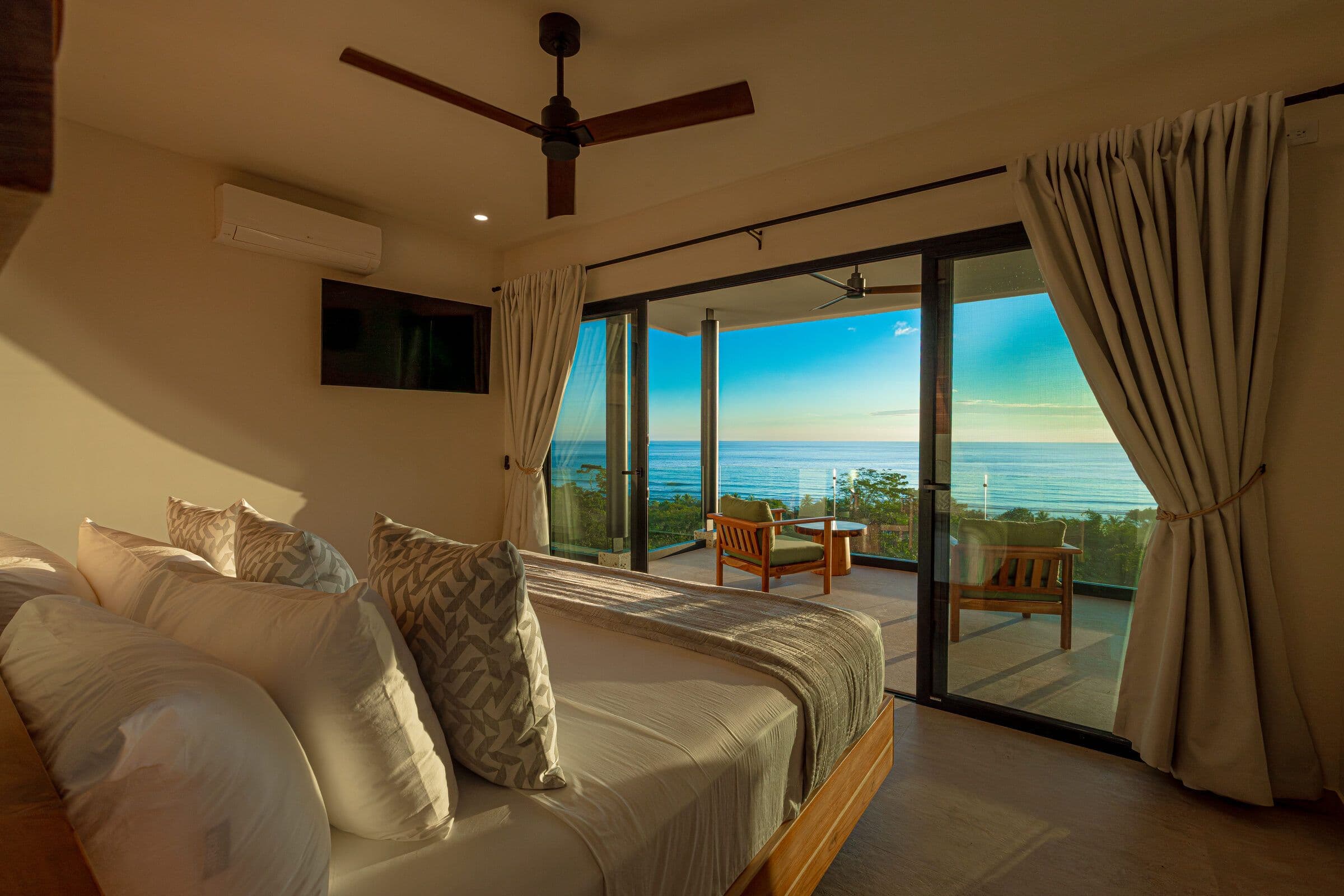Bedroom with private balcony at golden hour